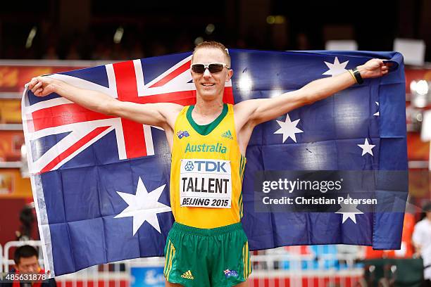 Jared Tallent of Australia celebrates after crossing the finish line to win silver in the Men's 50km Race Walk final during day eight of the 15th...