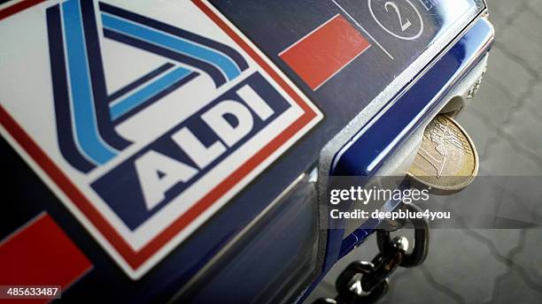 aldi shopping cart with coin - aldi stock pictures, royalty-free photos & images