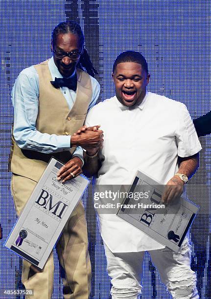 Recording artist Snoop Dogg and producer DJ Mustard accept awards onstage at the 2015 BMI R&B/Hip-Hop Awards at Saban Theatre on August 28, 2015 in...