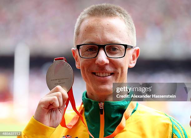 Silver medalist Jared Tallent of Australia poses on the podium during the medal ceremony for the Men's 50km Race Walk final during day eight of the...