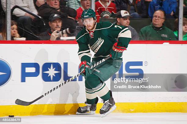 Jonathan Blum of the Minnesota Wild skates with the puck during the game against the Nashville Predators on April 13, 2014 at the Xcel Energy Center...