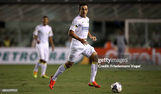 Thiago Ribeiro of Santos runs with the ball during the match between Santos and Mixto as part of Copa do Brasil 2014 at Vila Belmiro Stadium on April...