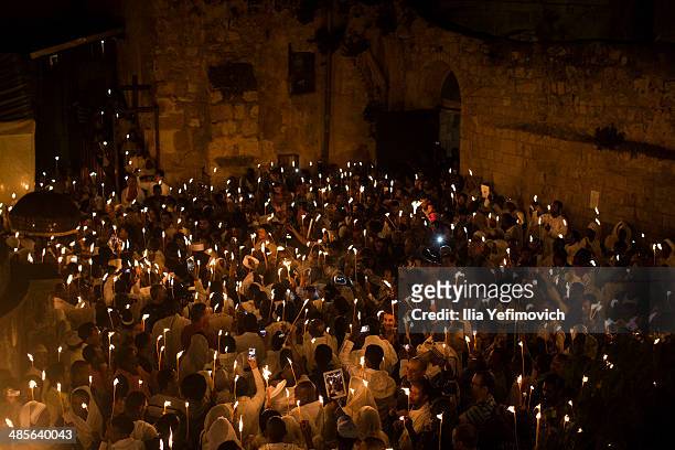 Ethiopian Orthodox worshippers light candles and pray during the Holy Fire ceremony at the Deir Al-Sultan, the Ethiopian section of the Church of the...