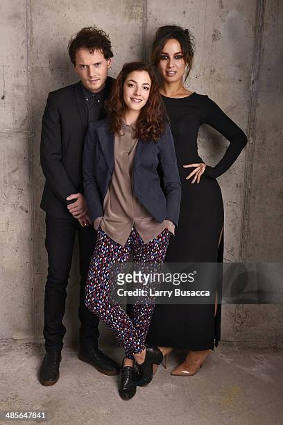 Actors Anton Yelchin, Olivia Thirlby and Berenice Marlohe from "5 to 7" pose for the 2014 Tribeca Film Festival Getty Images Studio on April 19, 2014...