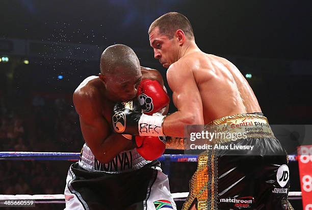 Scott Quigg connects with Tshifhiwa Munyai during the WBA World Super Bantamweight Title fight between Scott Quigg and Tshifhiwa Munyai at MEN Arena...