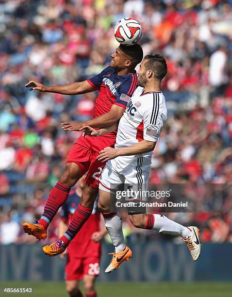 Quincy Amarikaw of the Chicago Fire heads the ball over A.J. Soares of the New England Revolution during an MLS match at Toyota Park on April19, 2014...