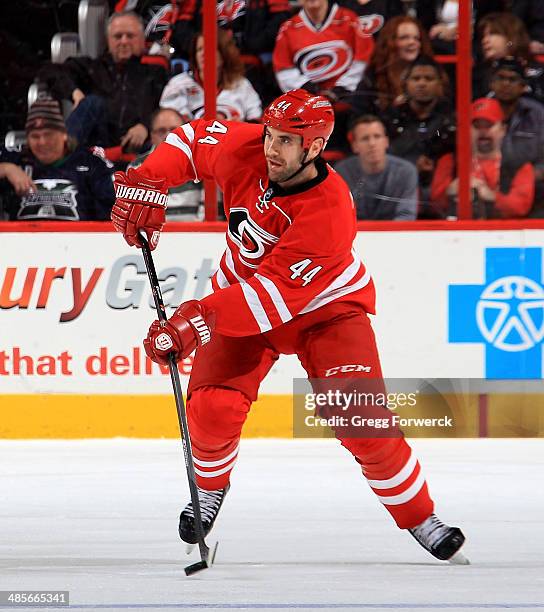 Jay Harrison of the Carolina Hurricanes looks to pass the puck during their NHL game against the Washington Capitals at PNC Arena on April 10, 2014...