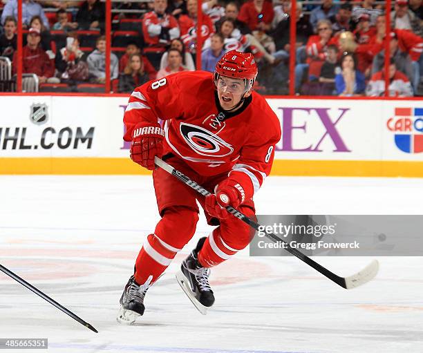 Andrei Loktionov#8 of the Carolina Hurricanes shoots the puck during their NHL game against the Washington Capitals at PNC Arena on April 10, 2014 in...