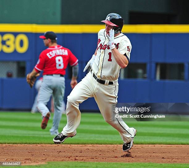 Tyler Pastornicky of the Atlanta Braves rounds the bases for a triple against the Washington Nationals at Turner Field on April 13, 2014 in Atlanta,...