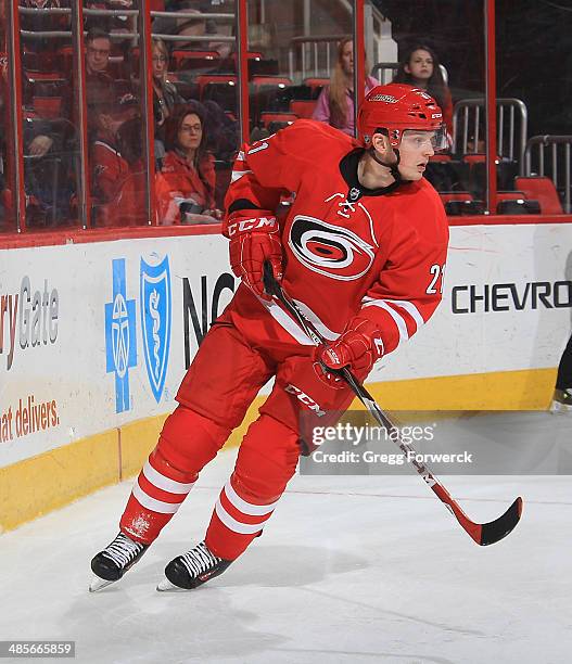 Drayson Bowman of the Carolina Hurricanes skates along the boards behind the net during their NHL game against the Washington Capitals at PNC Arena...