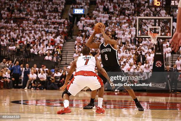 Alan Anderson of the Brooklyn Nets handles the ball against Kyle Lowry of the Toronto Raptors during game 1 of their quarter final NBA Eastern...