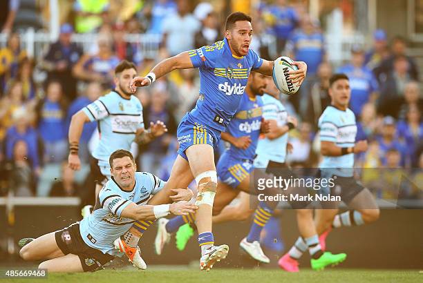 Corey Norman of the Eels makes a line break during the round 25 NRL match between the Parramatta Eels and the Cronulla Sharks at Pirtek Stadium on...