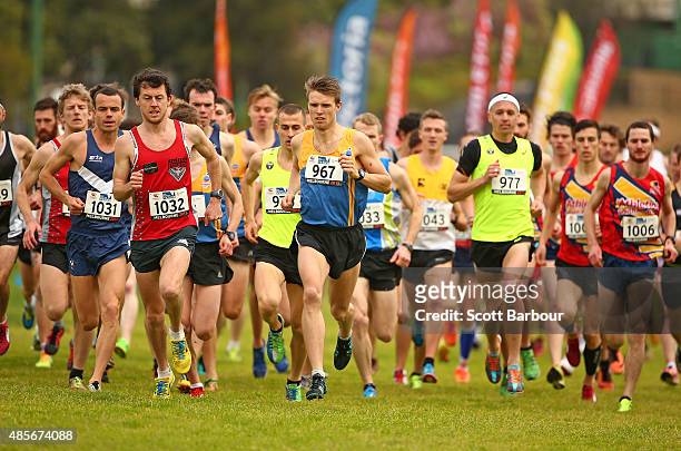 Competitors run in the Mens 12k Run CC Open race during the Australian Cross Country Championships at Moonee Valley Racecourse on August 29, 2015 in...