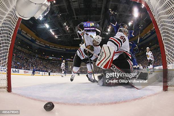 Chris Porter of the St. Louis Blues celebrates after Corey Crawford and Nick Leddy of the Chicago Blackhawks give up the game-winning goal in Game...