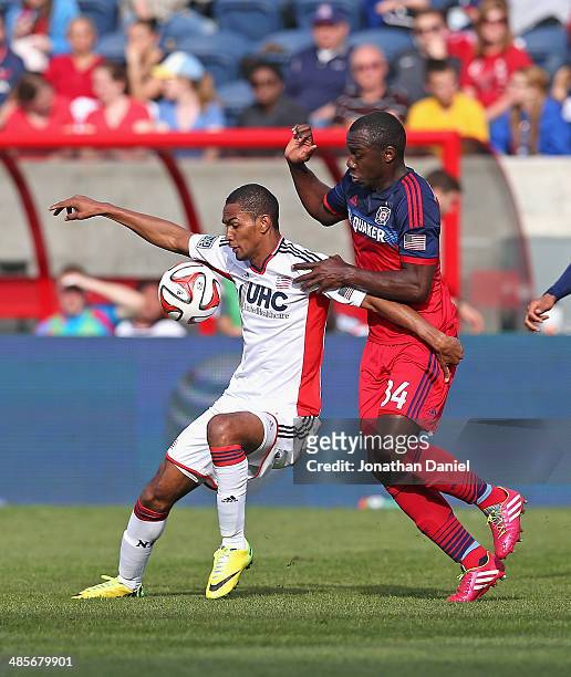 Jhon Kennedy Hurtado of the Chicago Fire and Jerry Bengtson of the New England Revolution battle for the ball during an MLS match at Toyota Park on...