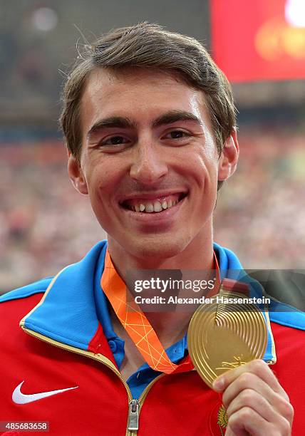 Gold medalist Sergey Shubenkov of Russia poses on the podium during the medal ceremony for the Men's 110 metres hurdles final during day eight of the...