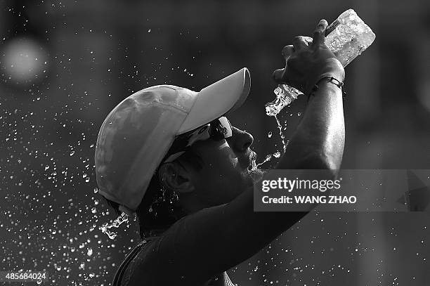 Ecuador's Andres Chocho competes in the final of the men's 50 kilometres race walk athletics event at the 2015 IAAF World Championships at the...