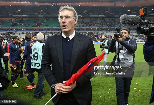 Coach of PSG Laurent Blanc celebrates the victory at the end of the French League Cup Final between Olympique Lyonnais OL and Paris Saint-Germain FC...