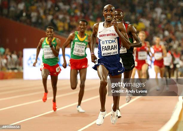 Mohamed Farah of Great Britain crosses the finish line to win gold in the Men's 5000 metres final during day eight of the 15th IAAF World Athletics...