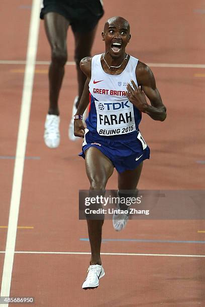 Mohamed Farah of Great Britain crosses the finish line to win gold in the Men's 5000 metres final during day eight of the 15th IAAF World Athletics...