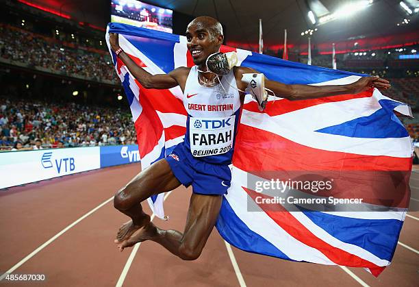Mohamed Farah of Great Britain celebrates after crossing the finish line to win gold in the Men's 5000 metres final during day eight of the 15th IAAF...