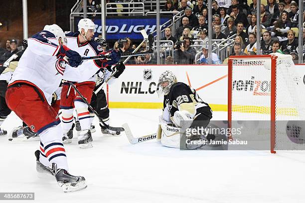 Jack Johnson of the Columbus Blue Jackets scores the game-tying goal on goaltender Marc-Andre Fleury of the Pittsburgh Penguins on a power play in...