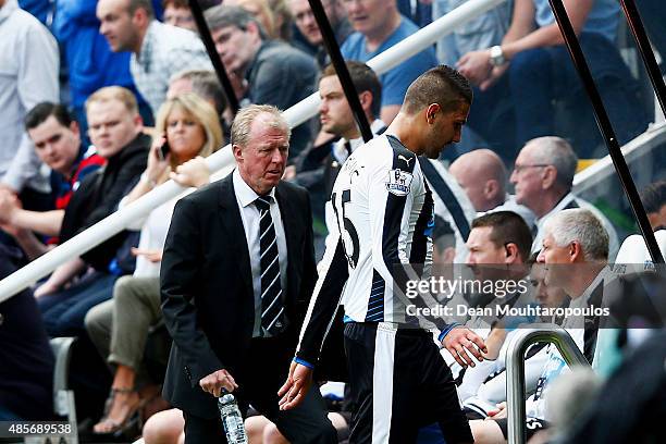 Aleksandar Mitrovic of Newcastle United walks past Steve McClaren manager of Newcastle United while leaving the pitch after being shown a red card...