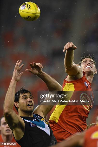 Zac Smith of the Suns competes for the ball during the round 22 AFL match between the Gold Coast Suns and the Port Adelaide Power at Metricon Stadium...