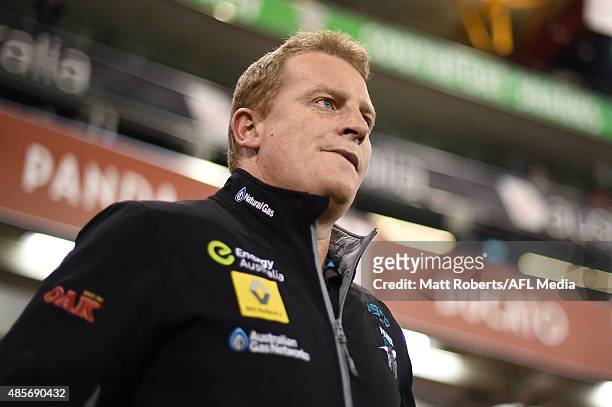Assistant coach Michael Voss of the Power looks on before the round 22 AFL match between the Gold Coast Suns and the Port Adelaide Power at Metricon...
