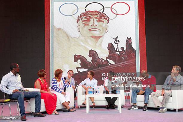 Dwight Phillips , Donna Prather Williams , Beverly Owens Prather , Joanna Hayes , Ato Boldon , Mike Powell and Luc Dayan on stage as Jesse Owens'...