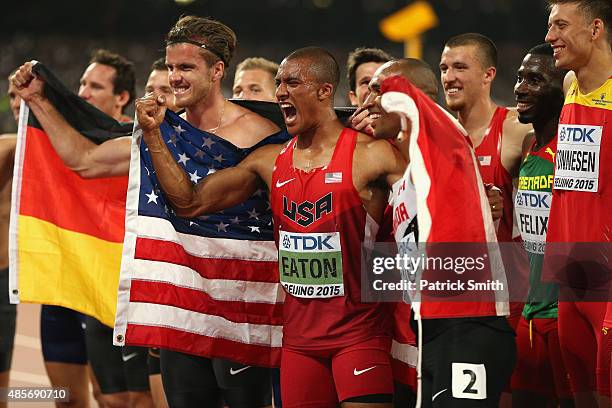 Bronze medalist Rico Freimuth of Germany, gold medalist Ashton Eaton of the United States and silver medalist Damian Warner of Canada celebrate after...