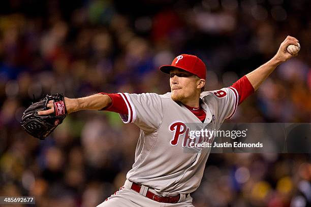 Relief pitcher Jacob Diekman of the Philadelphia Phillies delivers to home plate during the eighth inning against the Colorado Rockies at Coors Field...