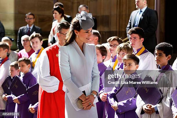 Catherine, Duchess of Cambridge greets members of the cathedral choir following Easter Sunday Service at St Andrews Cathedral on April 20, 2014 in...