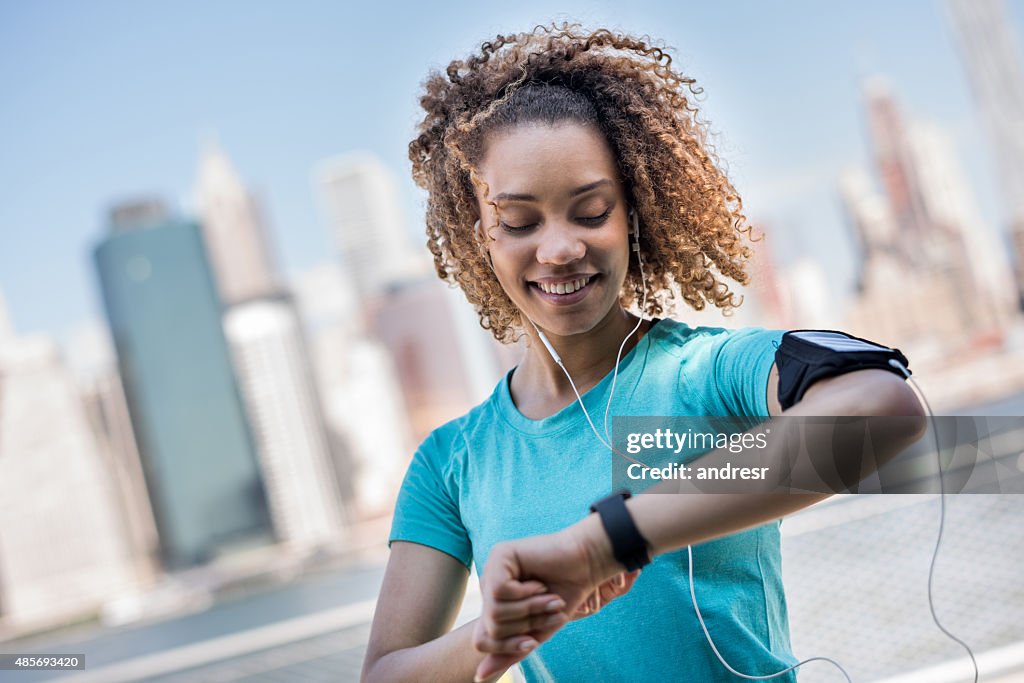 Sportive woman tracking her workout progress