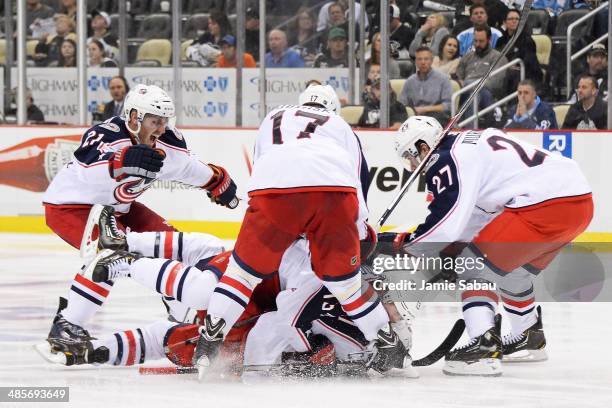 James Wisniewski, Brandon Dubinsky, Ryan Murray and Cam Atkinson, all of the Columbus Blue Jackets, celebrate with Matt Calvert who scored the...