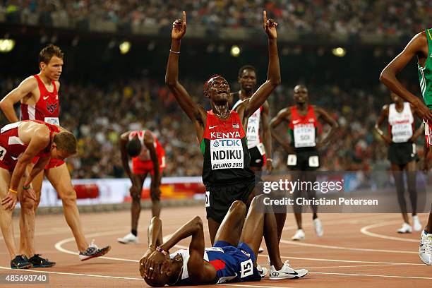 Mohamed Farah of Great Britain celebrates after crossing the finish line to win gold in the Men's 5000 metres final during day eight of the 15th IAAF...