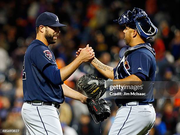 Jordan Walden and Gerald Laird of the Atlanta Braves celebrate after defeating the New York Mets at Citi Field on April 19, 2014 in the Flushing...