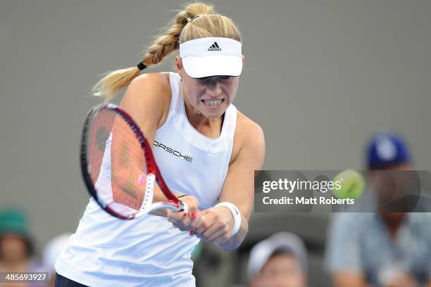 Angelique Kerber of Germany plays a backhand shot against Samantha Stosur of Australia during the Fed Cup Semi Final tie between Australia and...