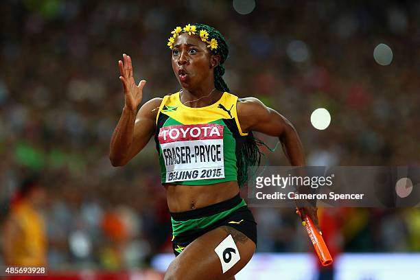 Shelly-Ann Fraser-Pryce of Jamaica sprints to the finish line to win gold in the Women's 4x100 Metres Relay final during day eight of the 15th IAAF...