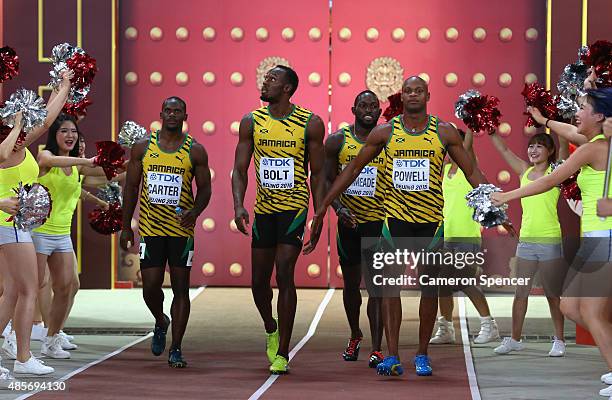 Nickel Ashmeade of Jamaica, Asafa Powell of Jamaica, Usain Bolt of Jamaica of Jamaica and Nesta Carter of Jamaica enter the stadium prior to the...