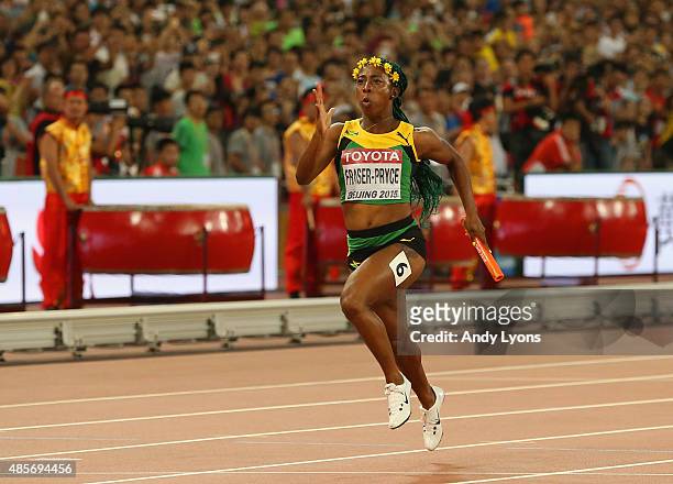 Shelly-Ann Fraser-Pryce of Jamaica crosses the finish line to win gold in the Women's 4x100 Metres Relay final during day eight of the 15th IAAF...