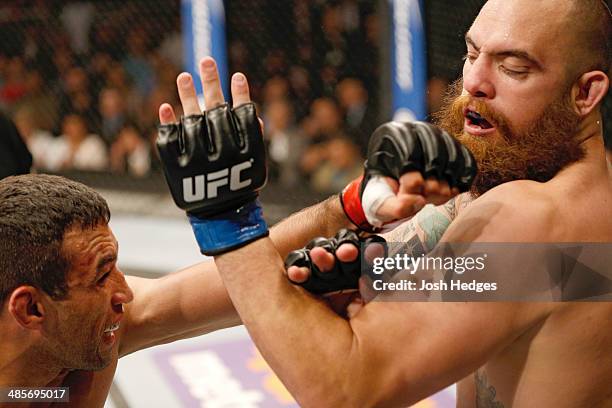 Fabricio Werdum punches Travis Browne in their heavyweight bout during the FOX UFC Saturday event at the Amway Center on April 19, 2014 in Orlando,...