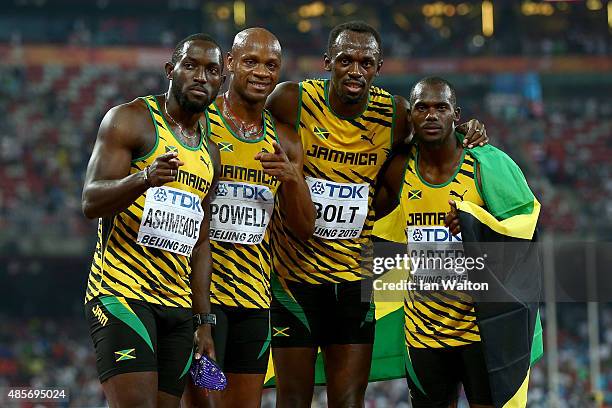 Nickel Ashmeade of Jamaica, Asafa Powell of Jamaica, Usain Bolt of Jamaica of Jamaica and Nesta Carter of Jamaica celebrate after winning gold in the...