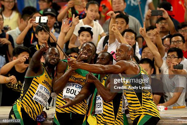 Nickel Ashmeade of Jamaica, Asafa Powell of Jamaica, Usain Bolt of Jamaica of Jamaica and Nesta Carter of Jamaica celebrate after winning gold in the...