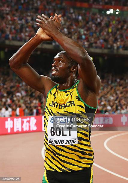 Usain Bolt of Jamaica celebrates after crossing the finish line to win gold in the Men's 4x100 Metres Relay final during day eight of the 15th IAAF...