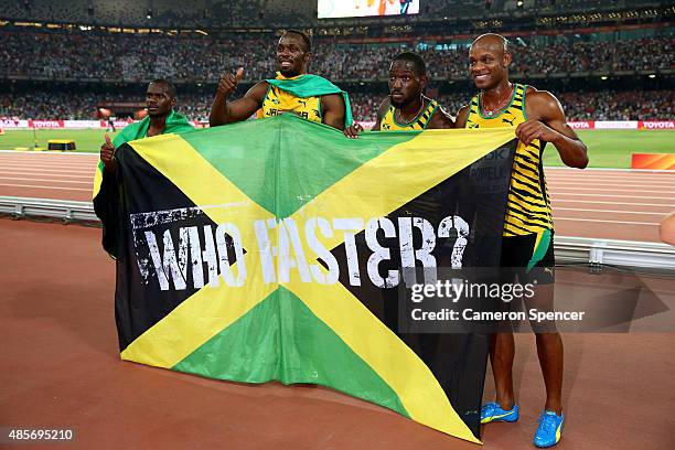 Nickel Ashmeade of Jamaica, Asafa Powell of Jamaica, Usain Bolt of Jamaica of Jamaica and Nesta Carter of Jamaica celebrate after winning gold in the...