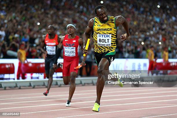 Usain Bolt of Jamaica crosses the finish line to win gold in the Men's 4x100 Metres Relay final during day eight of the 15th IAAF World Athletics...