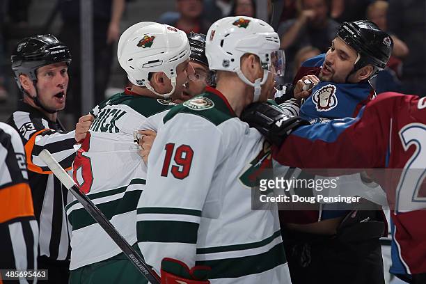 Cody McCormick of the Minnesota Wild and Patrick Bordeleau of the Colorado Avalanche are seperated by the officials during Game Two of the First...