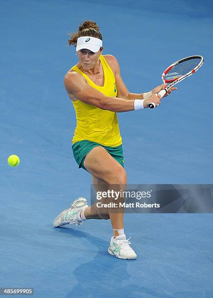 Samantha Stosur of Australia plays a backhand shot against Angelique Kerber of Germany during the Fed Cup Semi Final tie between Australia and...