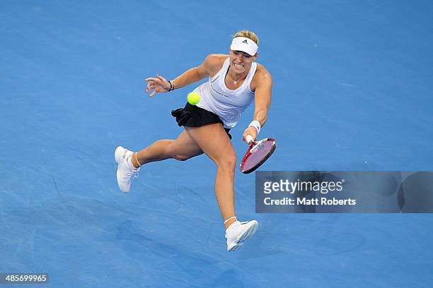 Angelique Kerber of Germany plays a forehand shot against Samantha Stosur of Australia during the Fed Cup Semi Final tie between Australia and...
